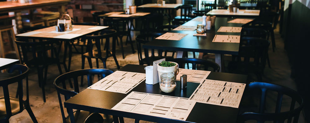 Sgt. Poopers can stop the spread of germs from tables and chairs to customers Image of restaurant tables