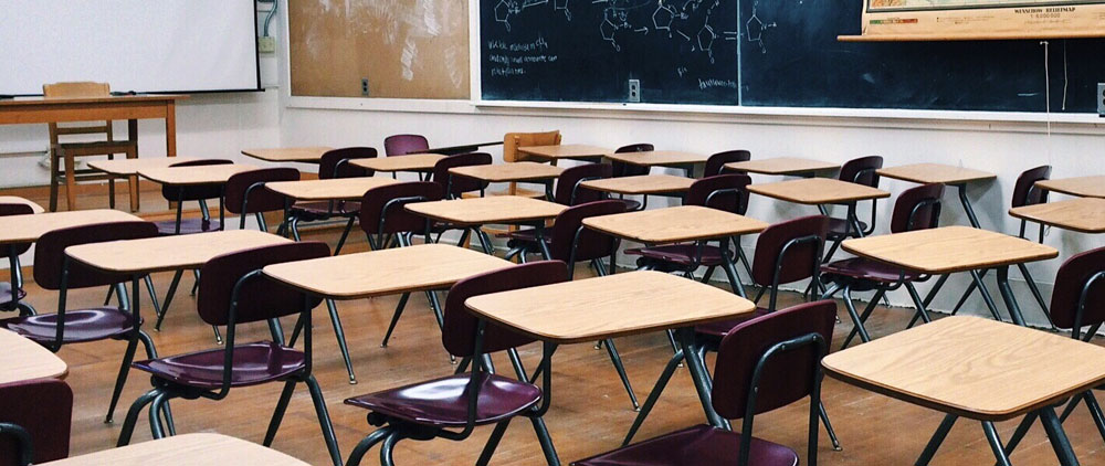 Sgt. Poopers can stop the spread of germs via school desks and chairs Image of school classroom