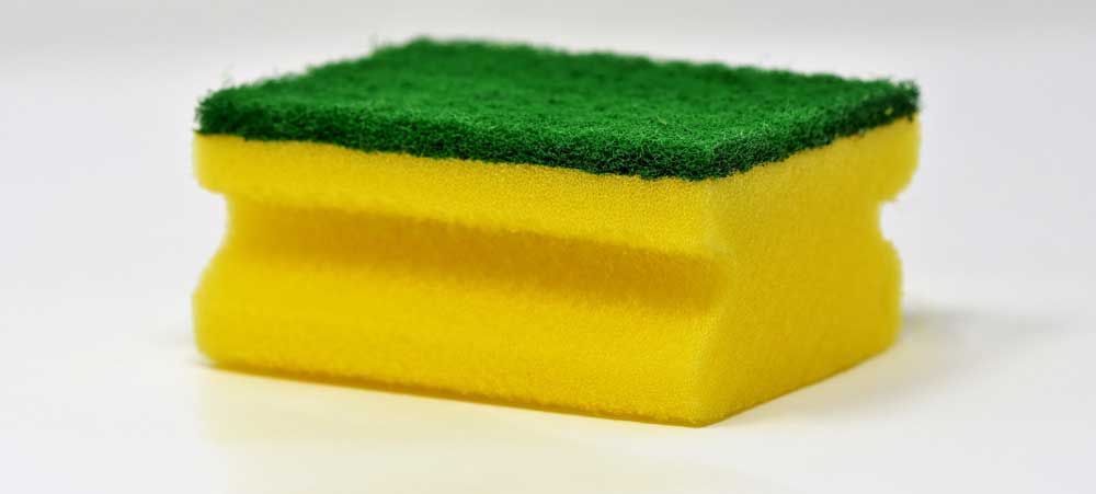 Biofilm does not respond to scrubbing Image of a cleaning sponge