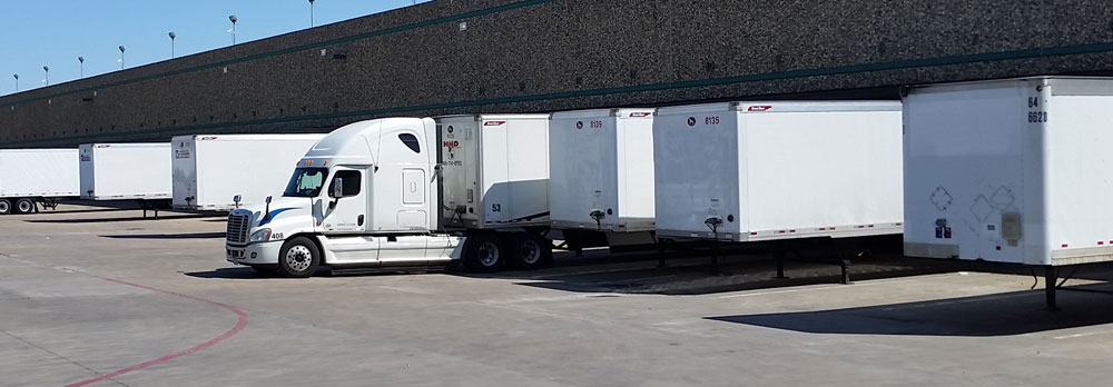 Sgt. Poopers provides disinfection for semi trucks cabs and trailers Image of rows of semi trucks