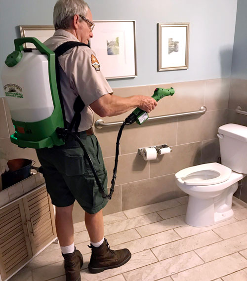 Sgt. Poopers provides touchless electrostatic disinfection to sanitize surfaces. Image of touchless electrostatic disinfection used to decontaminate bathroom surfaces