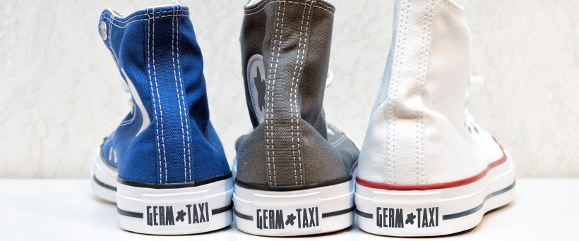 Shoes with "Germ Taxi" printed on the back.